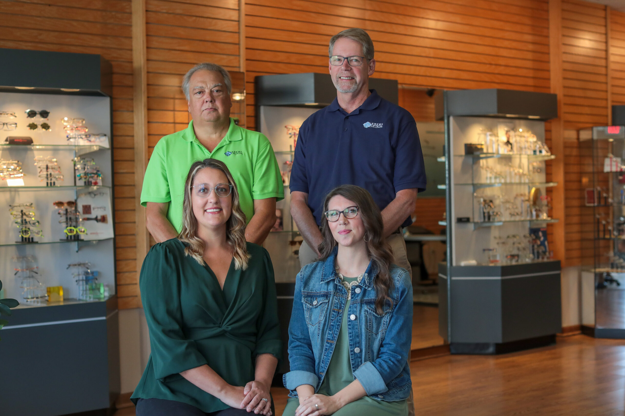 Krebs Optical professional staff with products on display in background